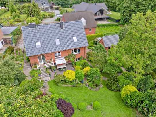 Modernisiertes Einfamilienhaus mit herrlichem Garten zum Mühlenteich und Baulücke in begehrter Lage