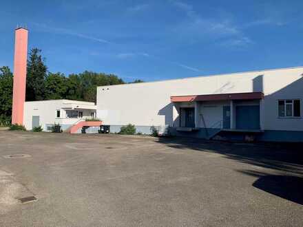 Produktions- und Lagerhalle sowie ein Mehrfamilienhaus