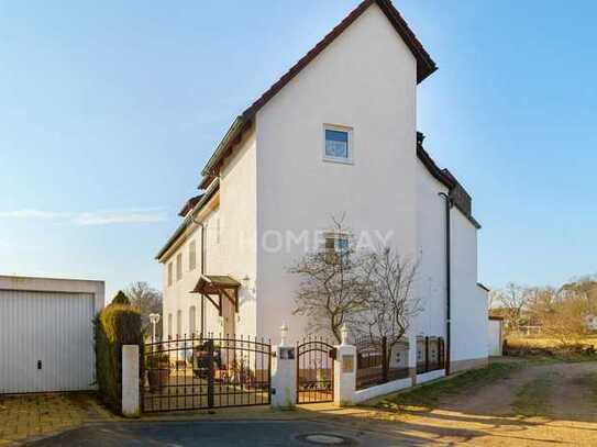 Attraktives Mehrfamilienhaus mit 3 Wohneinheiten, Dachterrasse und Wintergarten in Stein