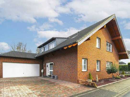 Attraktives Wohnen in familienfreundlicher Lage in Alsdorf: Einfamilienhaus mit Garten und Garage