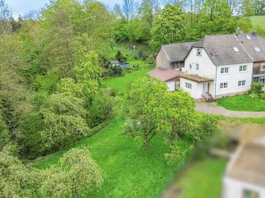 Teilrenoviertes Einfamilienhaus in schöner Aussichtslage von Lohmar mit Baugrundstück vo