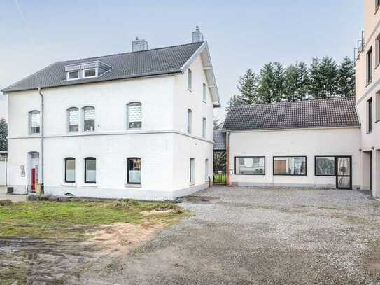 Kohlscheid: Büro mit Lagerflächen und vier angrenzenden Wohnungen sowie einer Großraumgarage