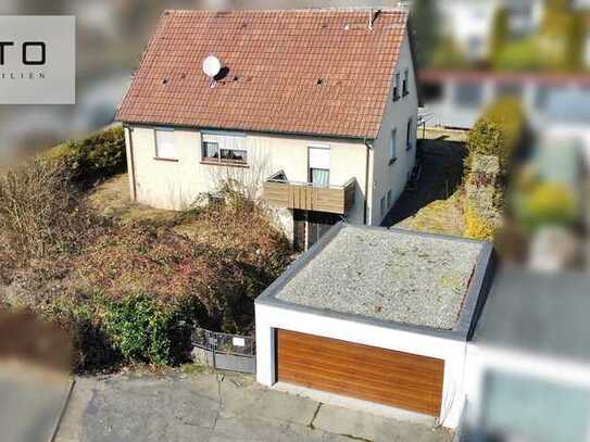 Einfamilienhaus mit großem Grundstück und Doppelgarage in sonniger Lage