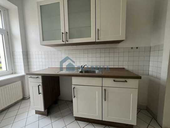 3-Zimmer-Wohnung im Erdgeschoss mit Einbauküche und gemeinschaftlich nutzbarem Gartengrundstück