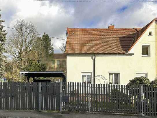 Raum für Ihre Ideen: Vorteilhaft geschnittene DHH mit Garten, Anbau, Doppelcarport und Potenzial