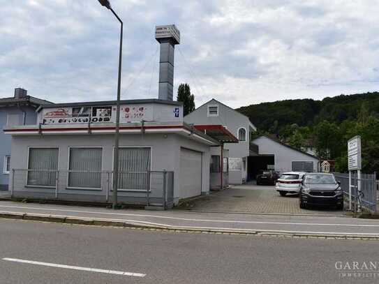 Wohn- und Geschäftsgebäude, Kfz-Werkstatt mit Lackier-Halle und Ausstellungsraum