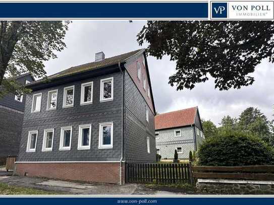 Vielseitiges 3-Familienhaus mit Garten und Schuppen mit 3 Garagen in Top-Lage