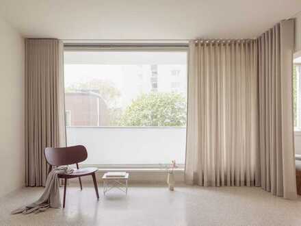 Erstbezug: Design-Apartment mit grossem Südwest-Balkon, Terrazzo-Böden & offener Kirschholz