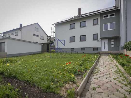 Charmante 4-Zimmerwohnung im ersten Obergeschoss mit Balkon und Gartenanteil