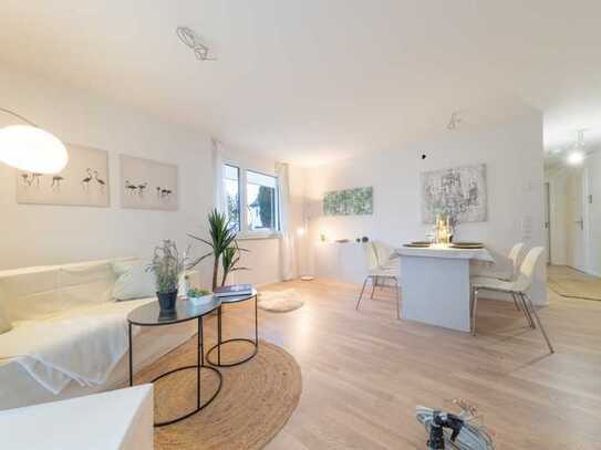 Neubau - Idyllisch, modern, gut angebunden: 2 Zimmer Wohnung mit EBK, Terrasse und Gartenanteil