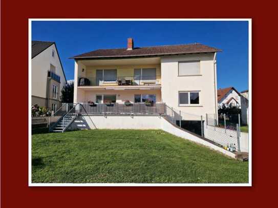 Attraktive Wohnung mit Wohnküche, 30 qm Terrasse & Garten im 2-Familienhaus in zentraler Lage!