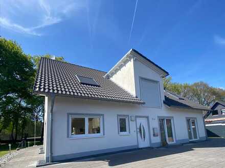 moderne 4-Zimmerwohnung mit großem Garten in Waldlage