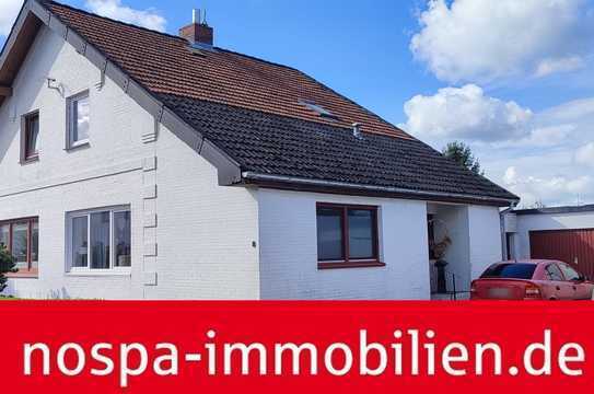 Ebenerdig bewohnbare und vielfach modernisierte Doppelhaushälfte mit Balkon und Garage!