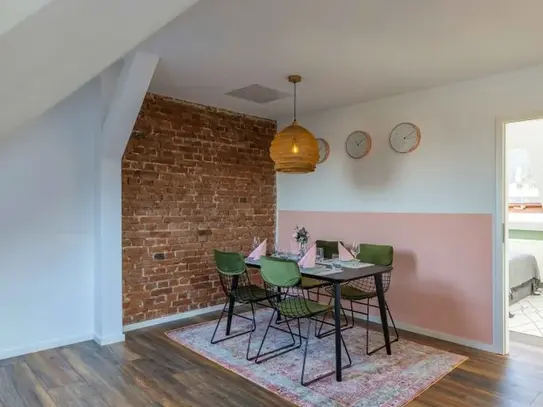 Private room with sloping ceilings in a coliving apartment