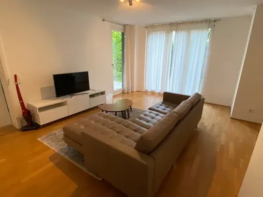 Beautiful modern terrace apartment with underground parking space in Munich.