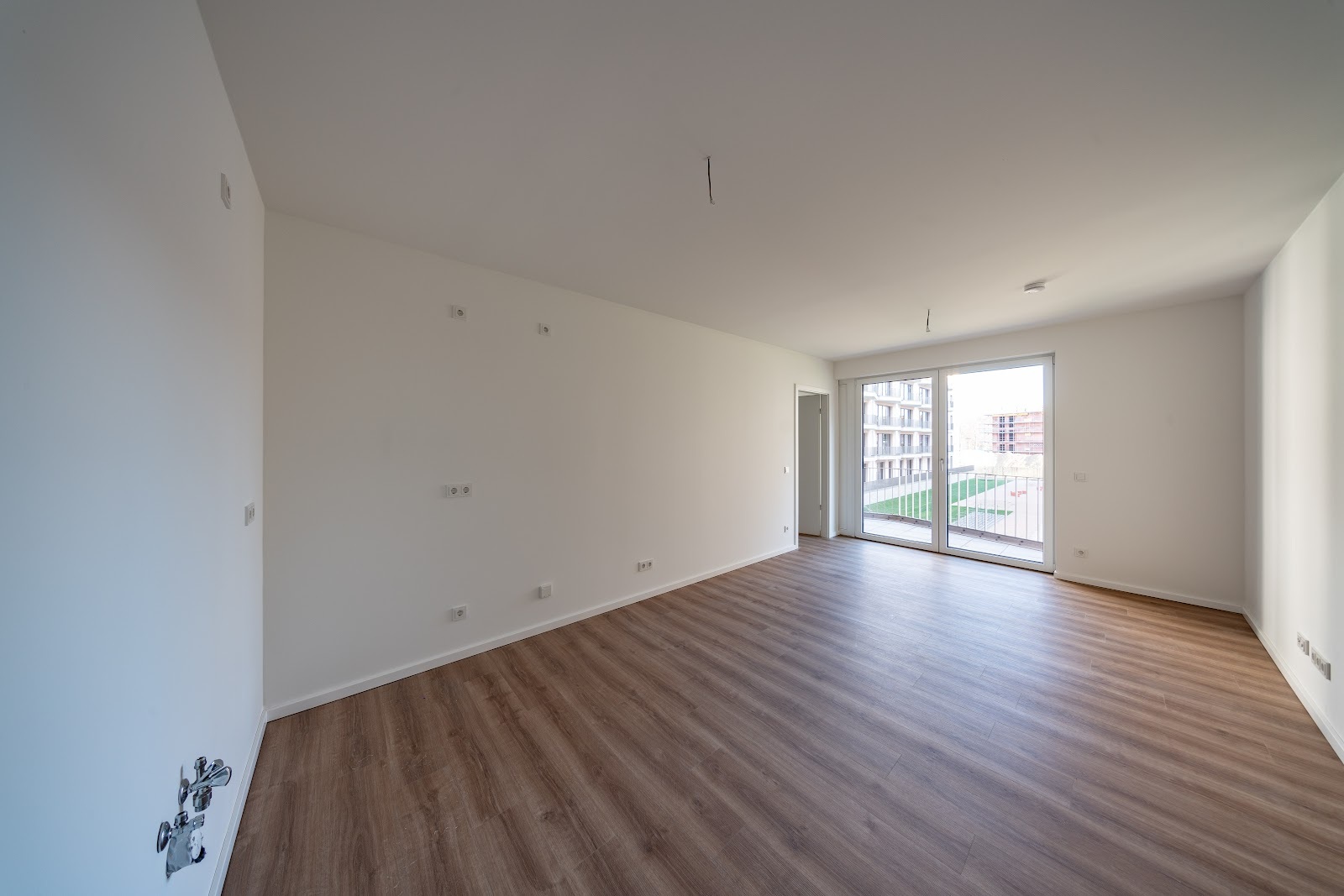 Neubauwohnung im Erstebug mit Fußbodenheizung und Balkon - Foto 1