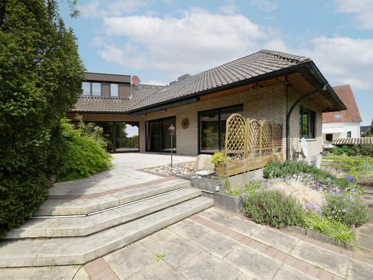 Vielseitige Traumimmobilie - Zweifamilienhaus mit Erdwärme 
und idyllischem Gartenparadies in Löhne