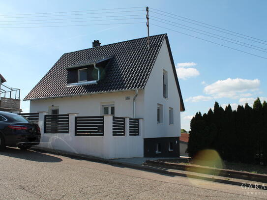 # Freistehendes Einfamilienhaus mit Garten und Garage #