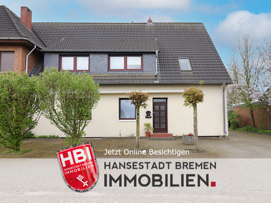 Weyhe / Modernisiertes Zweifamilienhaus mit Garten und Garage in guter Lage