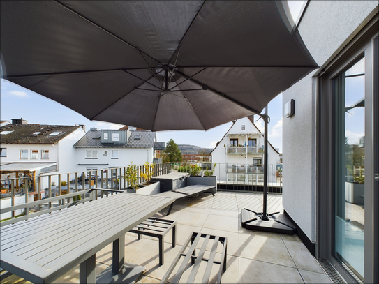 Penthouse-Panorama: Exquisite Wohnung mit weitläufiger Dachterrasse