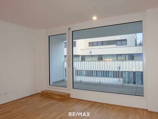 Besondere Neubau 2-Zimmer Wohnung mit Loggia und Tiefgaragenplatz in Ruhelage