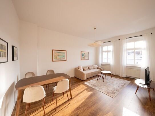 Cute stylishly furnished two-room apartment in vintage building with balcony