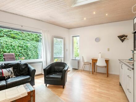 Modernisierte, helle und ruhige EG-Wohnung mit eigenem Terrassenbereich im Grünen