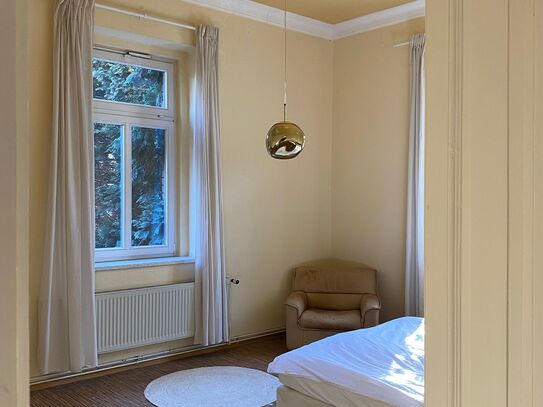 Belle etage with sunny garden in historic villa.