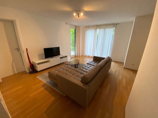 Beautiful modern terrace apartment with underground parking space in Munich.