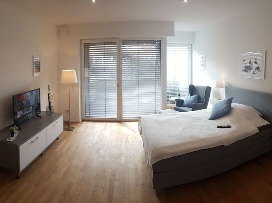 Modernes Neubau-Apartment in Rheinnähe mit Loggia und sicherem Tiefgaragenstellplatz