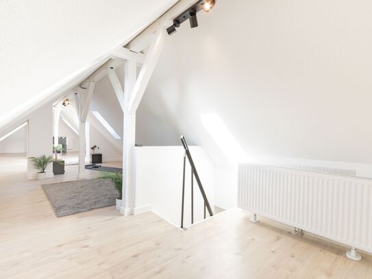 ***Modern, bright attic apartment with a feel-good factor***