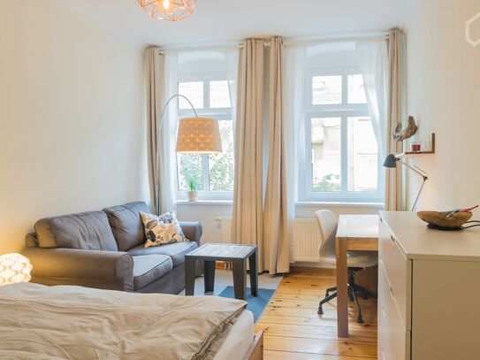 In the heart of Friedrichshain with balcony , bed + 1 sleeping sofa + garage*
