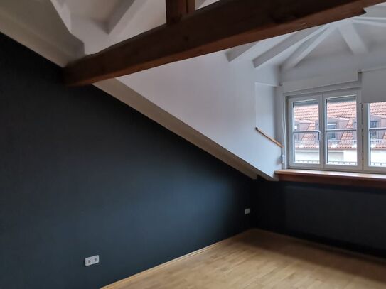 Exceptional, charming top-floor flat in the heart of Munich