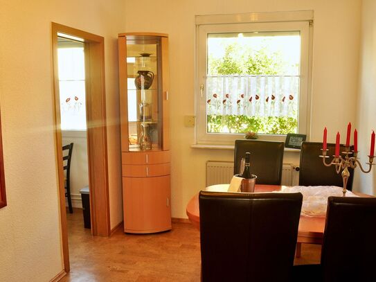 Elegantly furnished apartment with southwest balcony and shared garden terrace