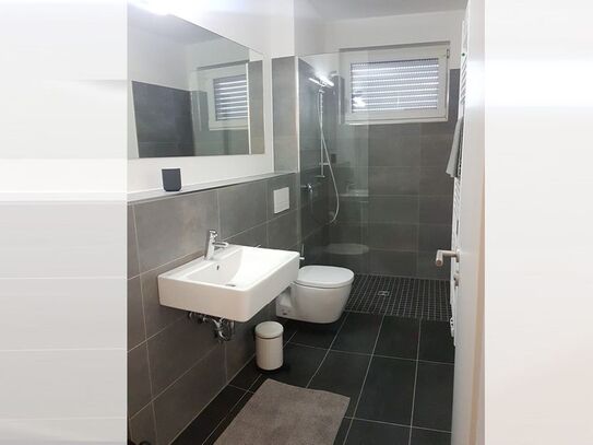 Serviced, modern apartment near the Rhine with loggia and secure underground parking