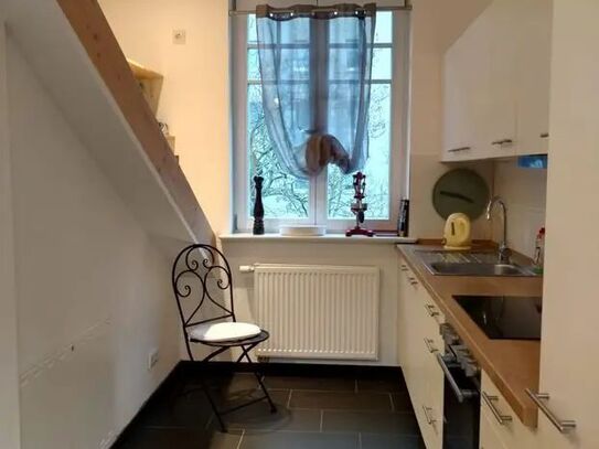 furnished designer attic - in a renovated old building with balcony - near the Havel river