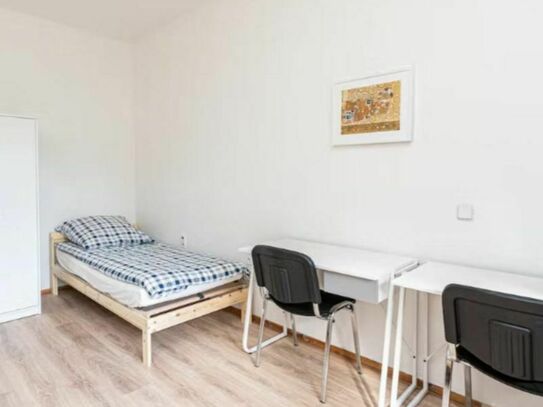Bed in a comfy twin bedroom with a balcony, near Tempelhofer Feld