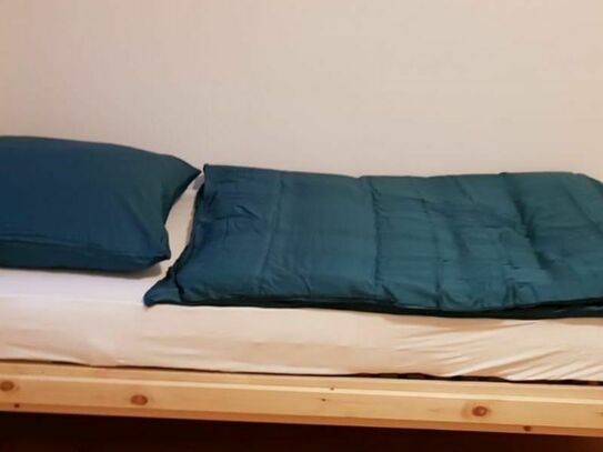 Bed in double bedroom in Spandau