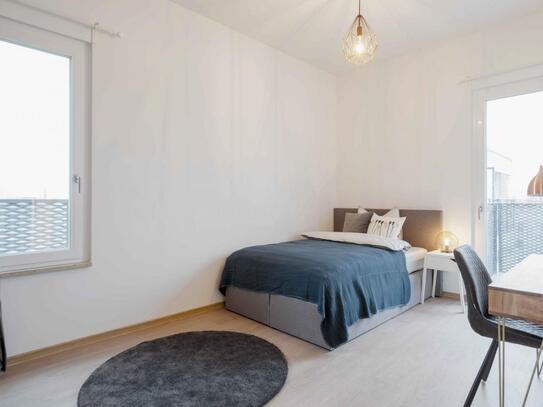 Single bedroom with TV and balcony in Berlin