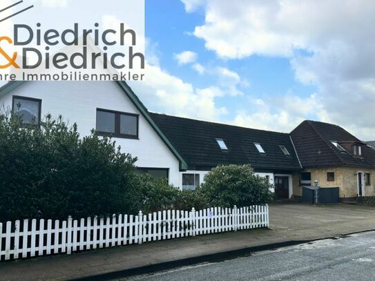 Verkauf eines vermieteten Zweifamilien- und eines Einfamilienhauses in gefragter Wohnlage in Heide-Ost