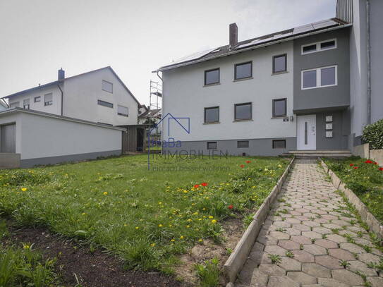 Charmante 4-Zimmerwohnung im ersten Obergeschoss mit Balkon und Gartenanteil