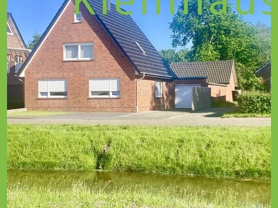 Ansprechendes Einfamilienhaus mit großer gemauerter Partyhütte und Garage an Kanallage zu Kaufen!