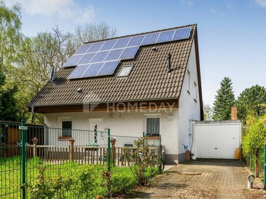 Modernes Einfamilienhaus mit Wintergarten, Gartenidylle und Photovoltaikanlage