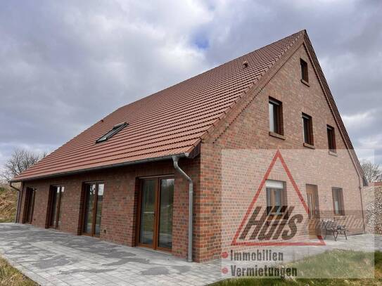 Neuwertige Erdgeschosswohnung mit Terrasse und Blick ins Grüne