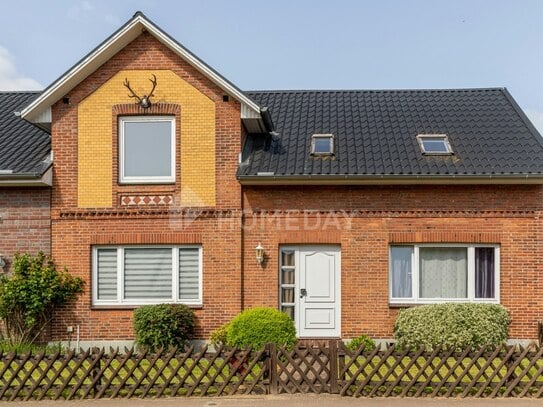 Einfamilienhaus mit zwei Wohneinheiten, Wintergarten, Terrasse und Blick ins Grüne in Hoisdorf