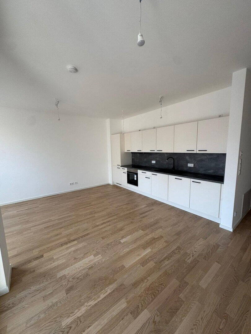 Direkt am Wasser ¬| Neubau + Erstbezug | ~67qm 2 Zi. | Loggia, Fahrstuhl, Einbauküche, Stellplatz - Photo 1