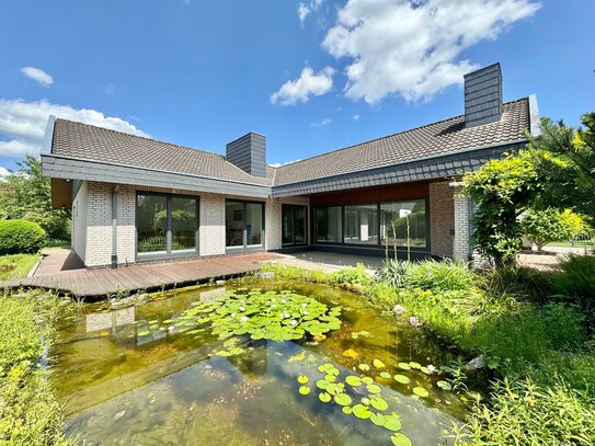 Exklusiver Bungalow mit Stil, Platz & schöner Gartenanlage in bevorzugter Wohnlage (Weststadt)