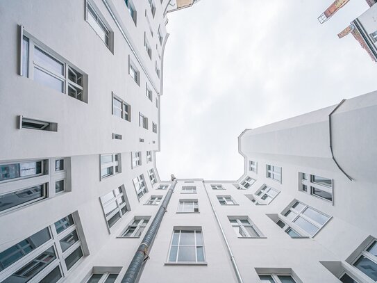 Mittendrin und trotzdem ruhig - Erdgeschosswohnung mit Balkon im Seitenflügel