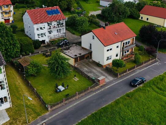 Zweifamilienhaus mit großem Garten und vielseitigem Nutzungspotential