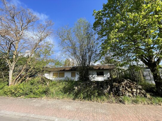 Bieterverfahren: Exklusives Baugrundstück mit Bestandshaus und fantastischem Taunusblick